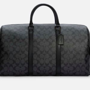 Coach Trekker 52 In Signature Canvas- Duffel
bag unisex